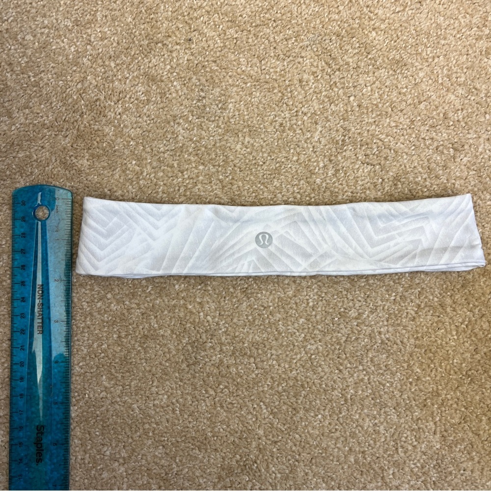 Lululemon flyaway tamer headband in neutral grey/white color. Like new.